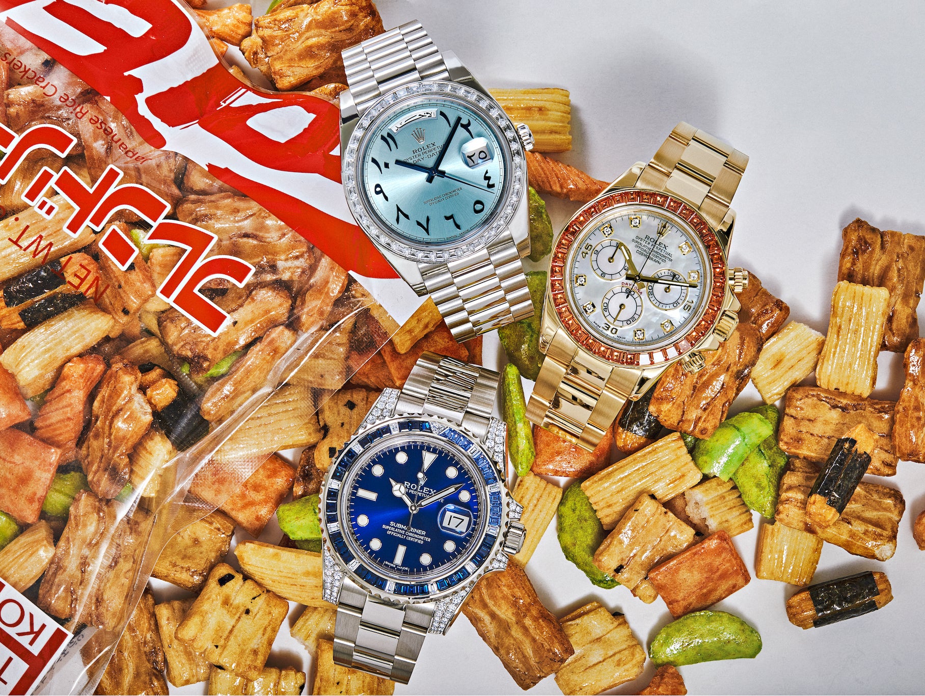 Off-Catalog Arabic Dial Day-Date 228396TBR, Mother of Pearl Daytona 116578SACO, and Submariner 116659SABR on Japanese Rice Crackers