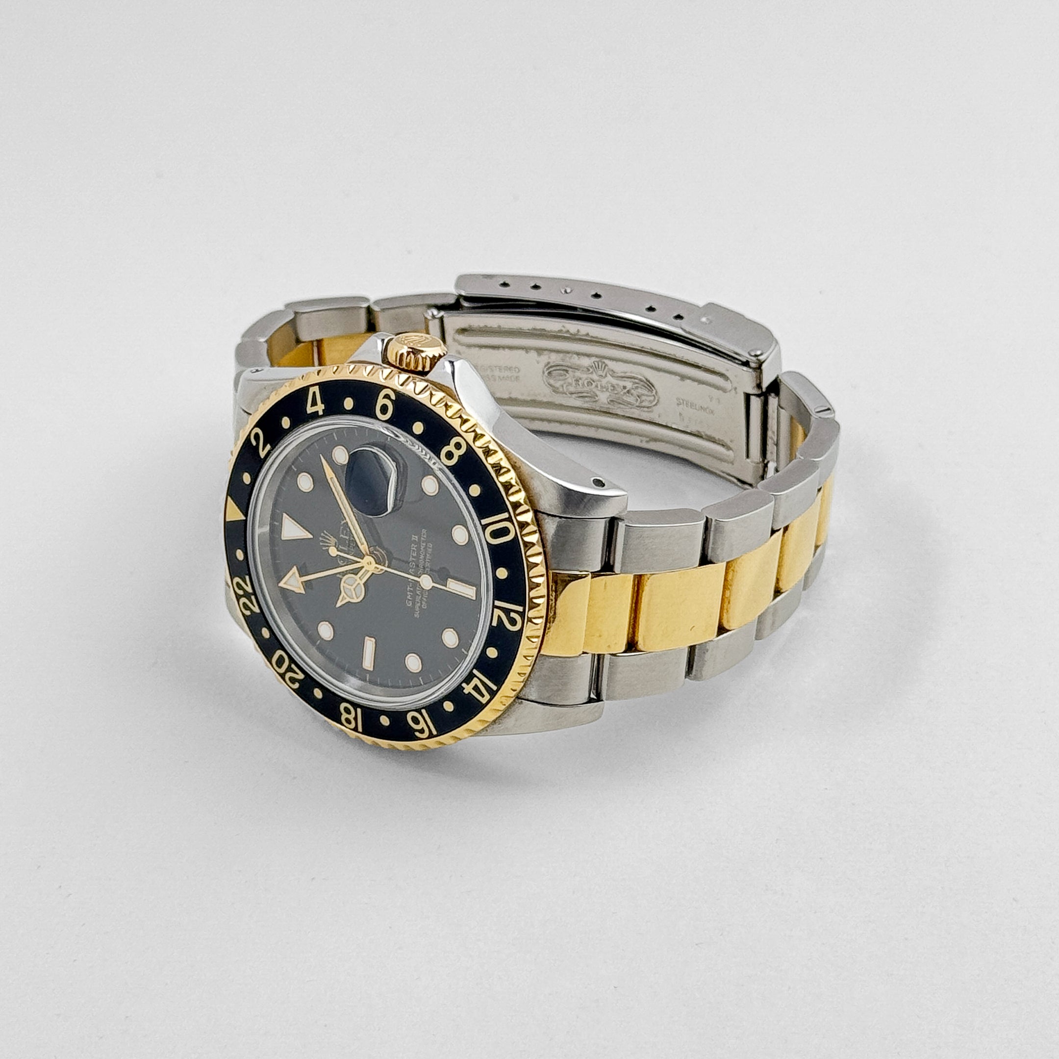 Rolex GMT-Master II 16713 Stainless Steel Yellow Gold Black Dial (1997) - Wrist Aficionado