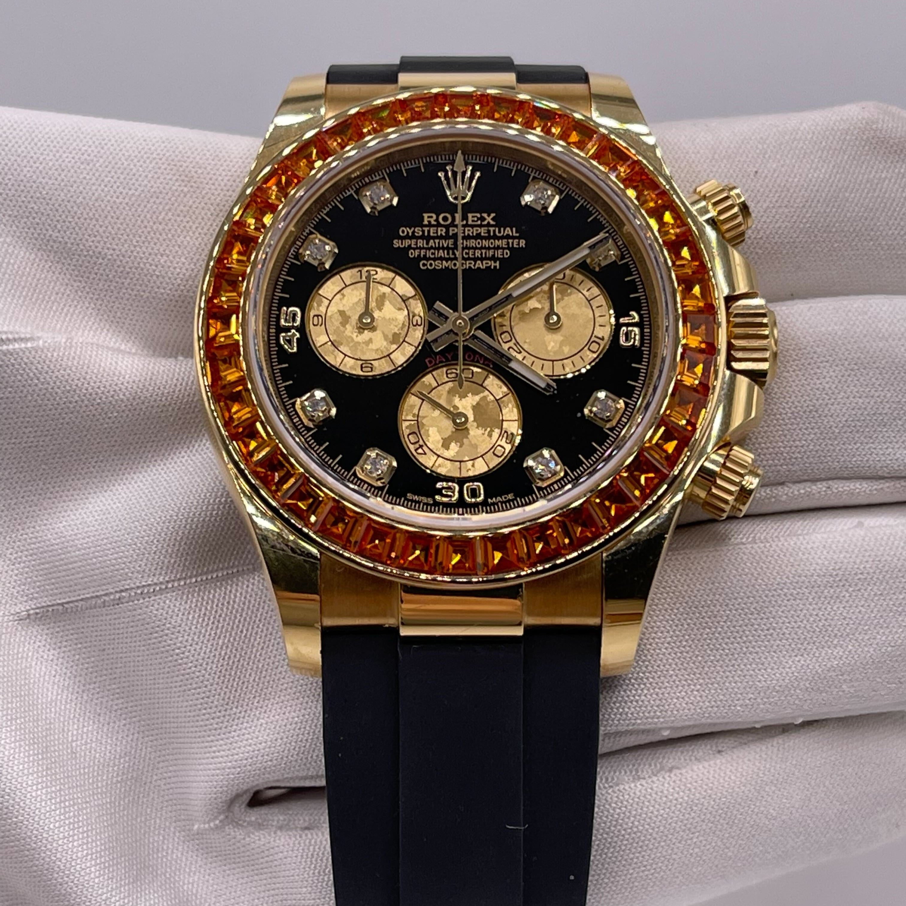 Luxury Watch Rolex Daytona Yellow Gold Orange Sapphire Bezel Black Diamond Dial 116588SACO Wrist Aficionado