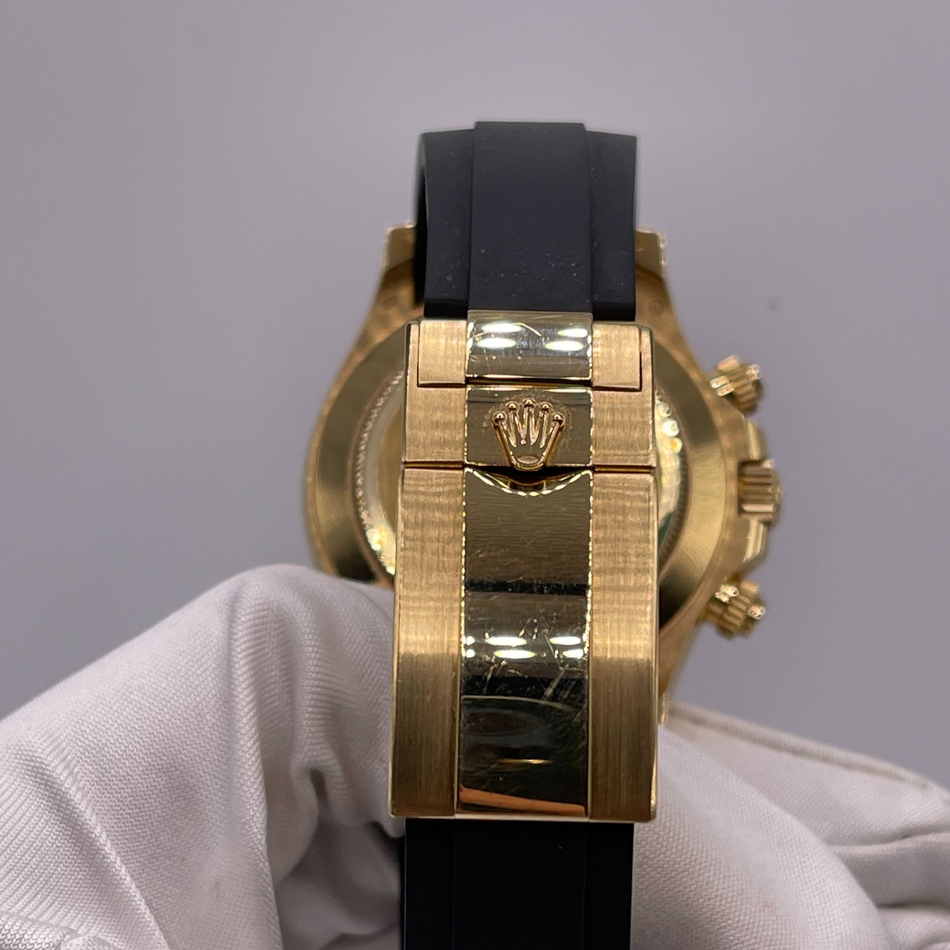 Luxury Watch Rolex Daytona Yellow Gold Orange Sapphire Bezel Black Diamond Dial 116588SACO Wrist Aficionado