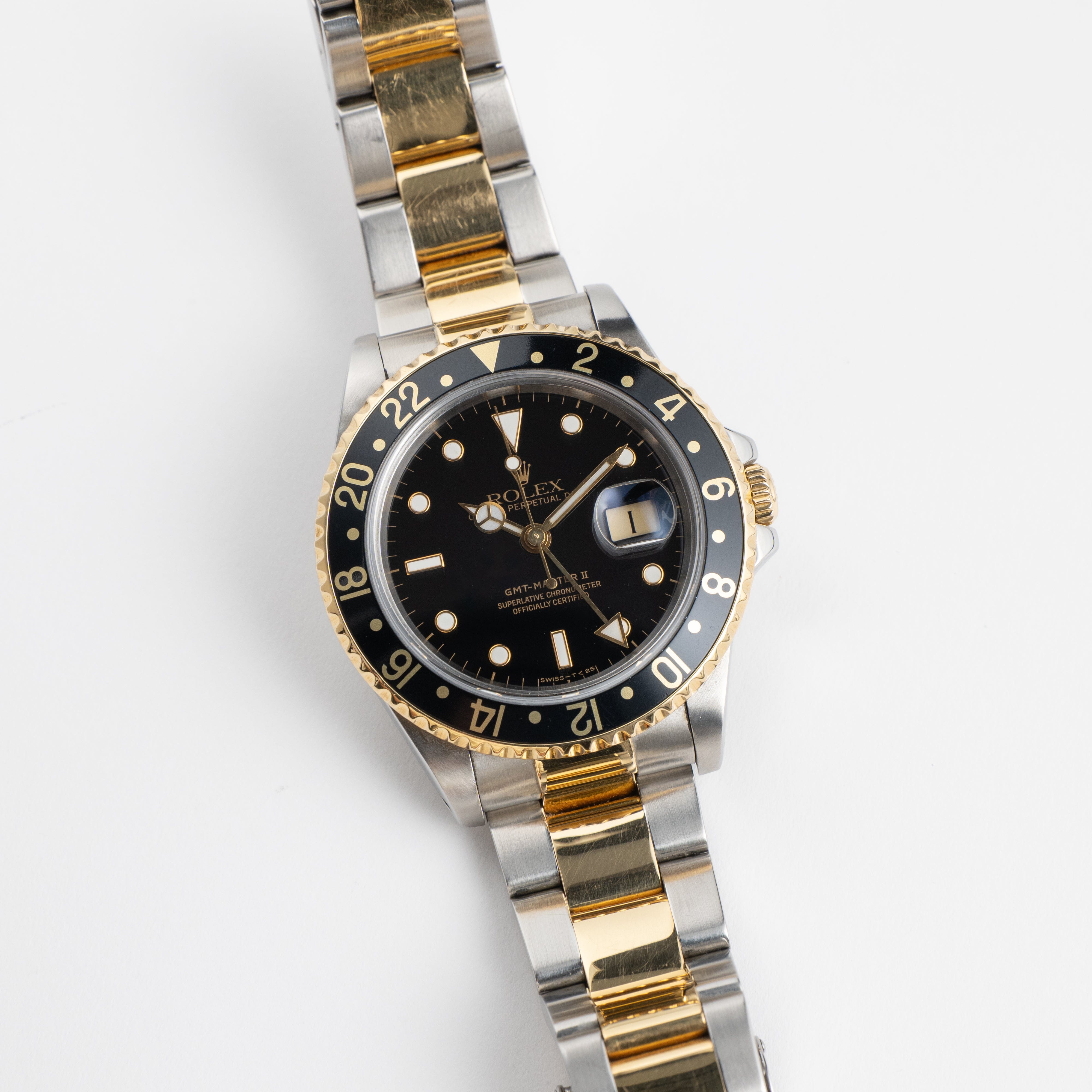 Rolex GMT-Master II 16713 Stainless Steel Yellow Gold Black Dial (1997)