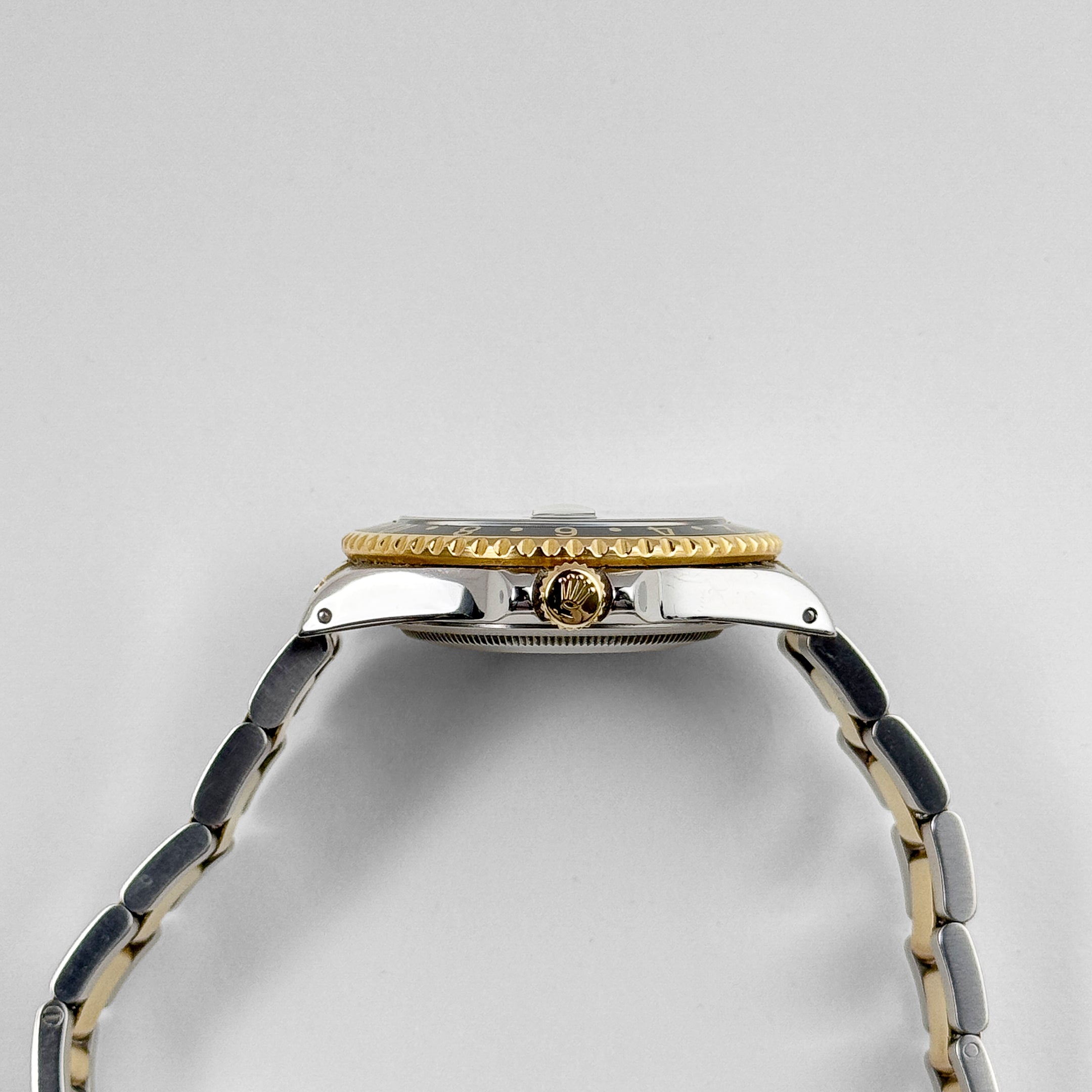 Rolex GMT-Master II 16713 Stainless Steel Yellow Gold Black Dial (1997) - Wrist Aficionado