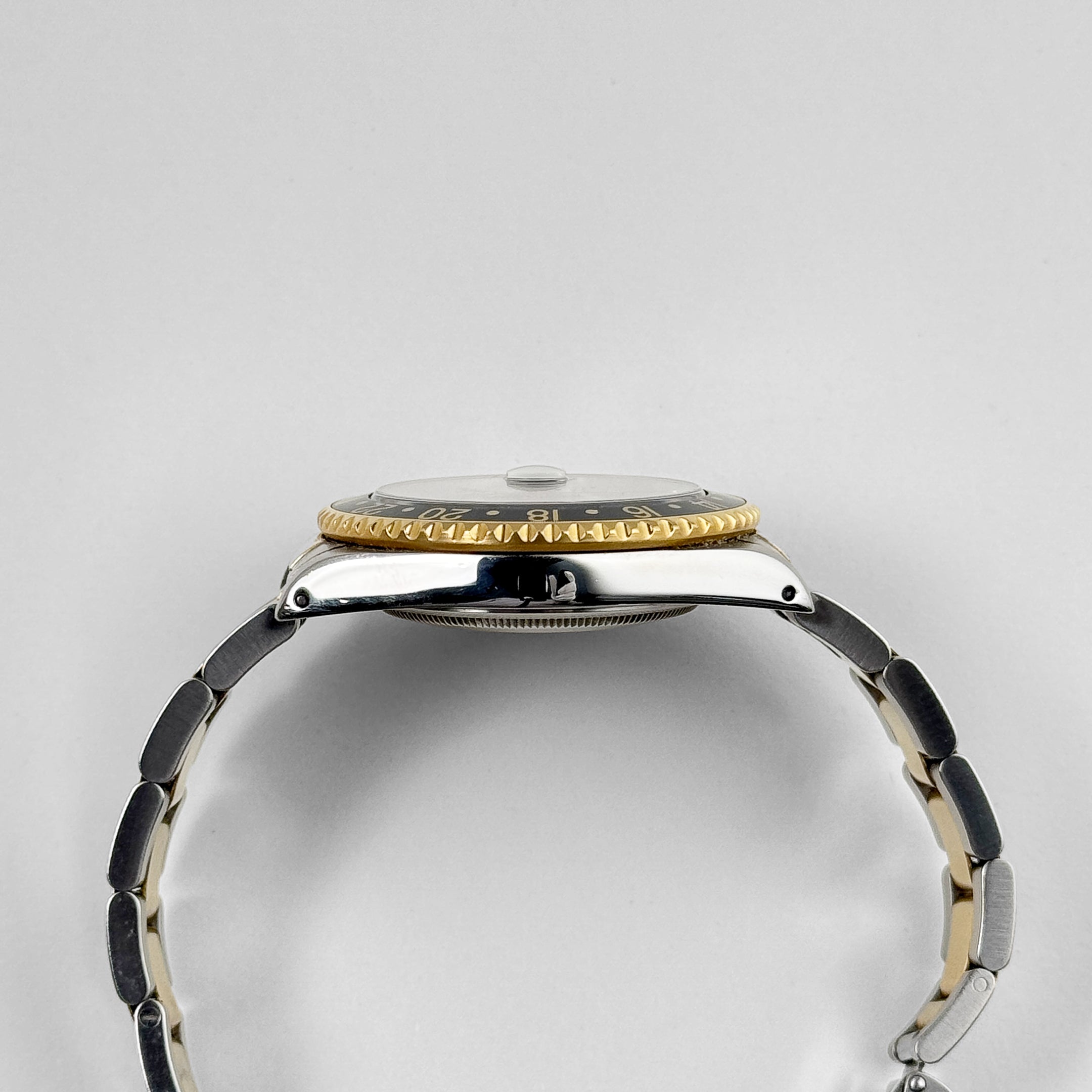 Rolex GMT-Master II 16713 Stainless Steel Yellow Gold Black Dial (1997) - Wrist Aficionado