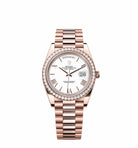 Rolex Day-Date 228235 Rose Gold White Roman Dial Diamond Bezel