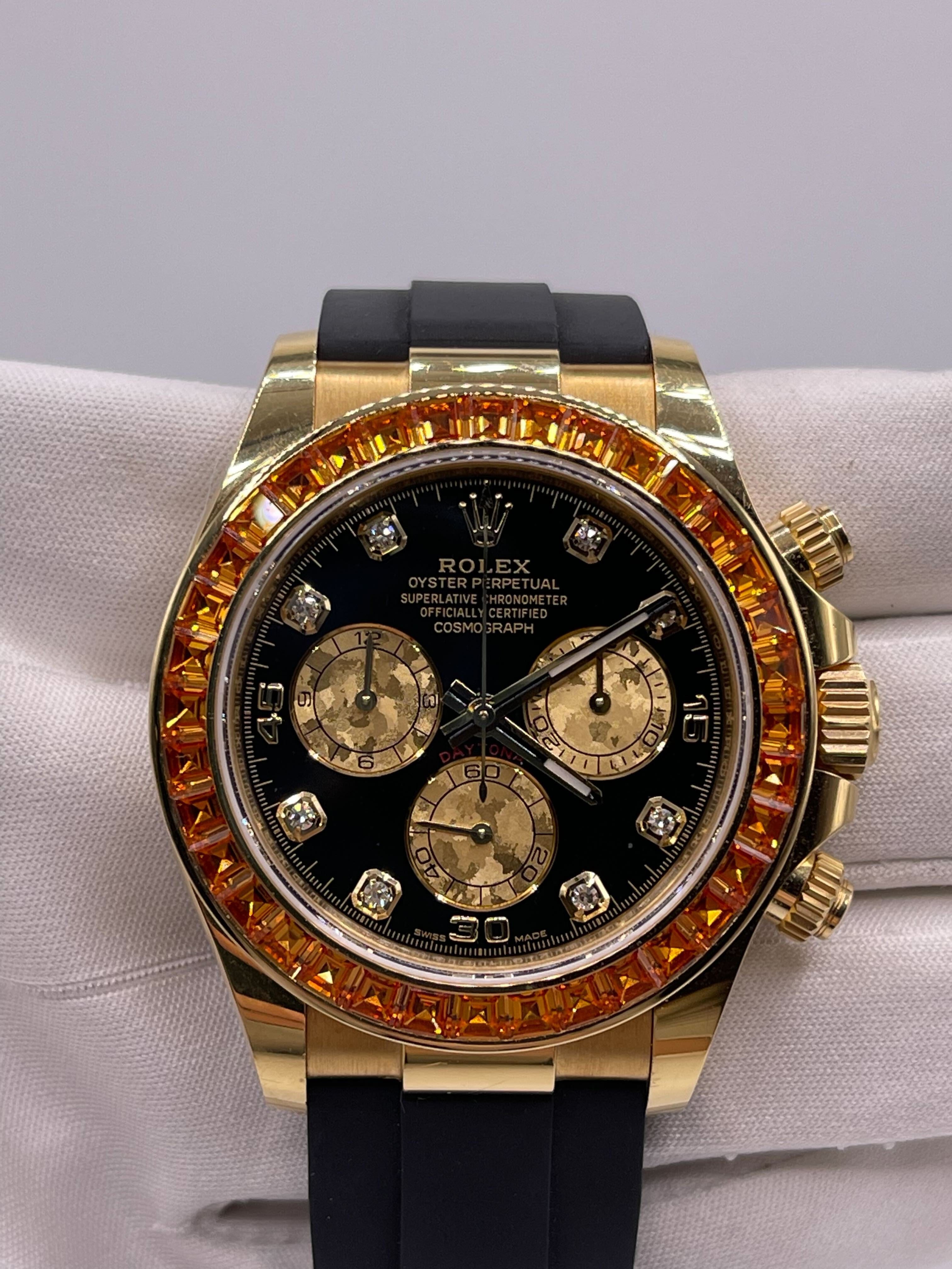 Luxury Watch Rolex Daytona Yellow Gold Orange Sapphire Bezel Black Diamond Dial 116588SACO Wrist Aficionado