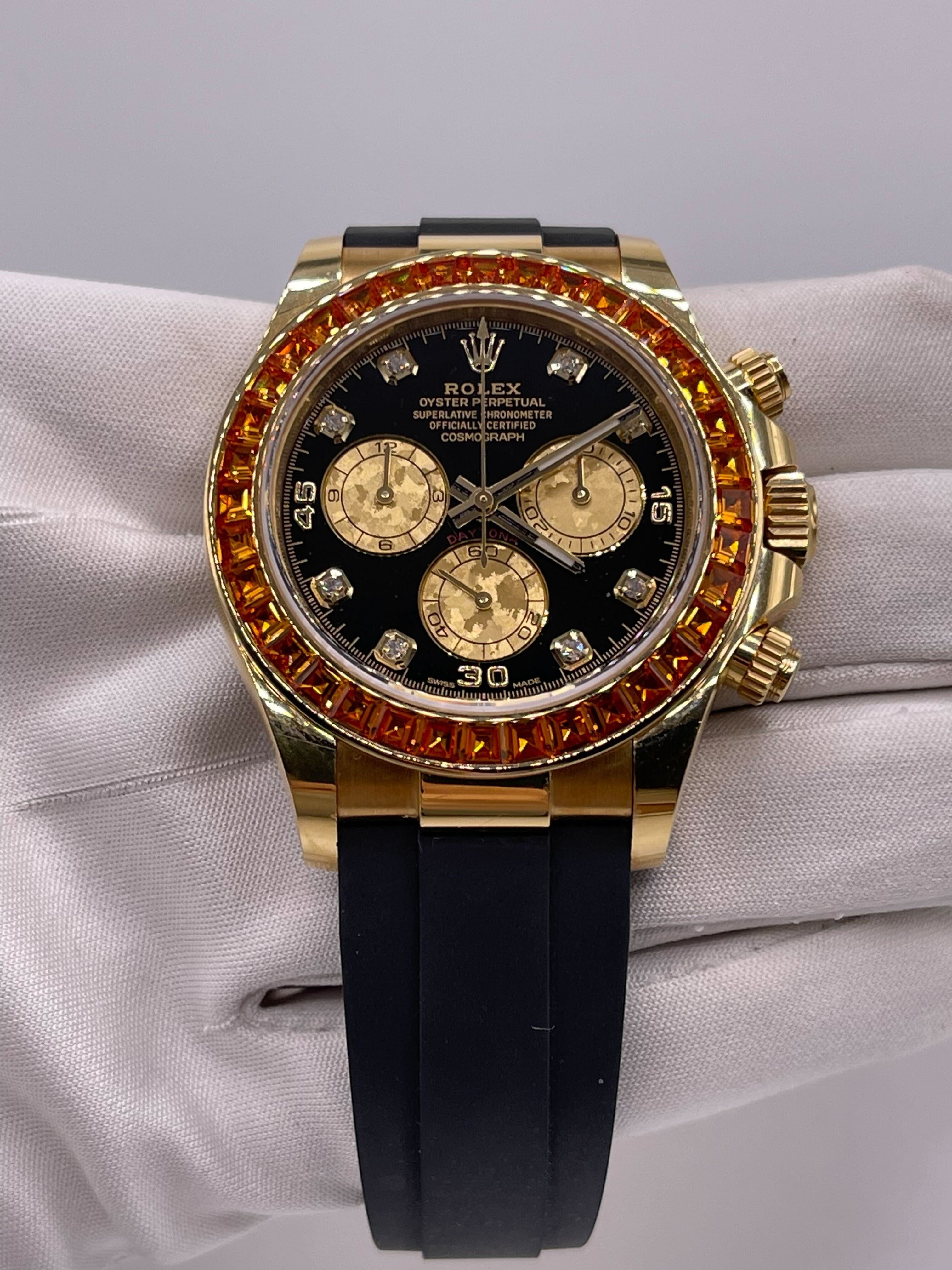 Luxury Watch Rolex Daytona Yellow Gold Orange Sapphire Bezel Black Diamond Dial 116588SACO Wrist Aficionado