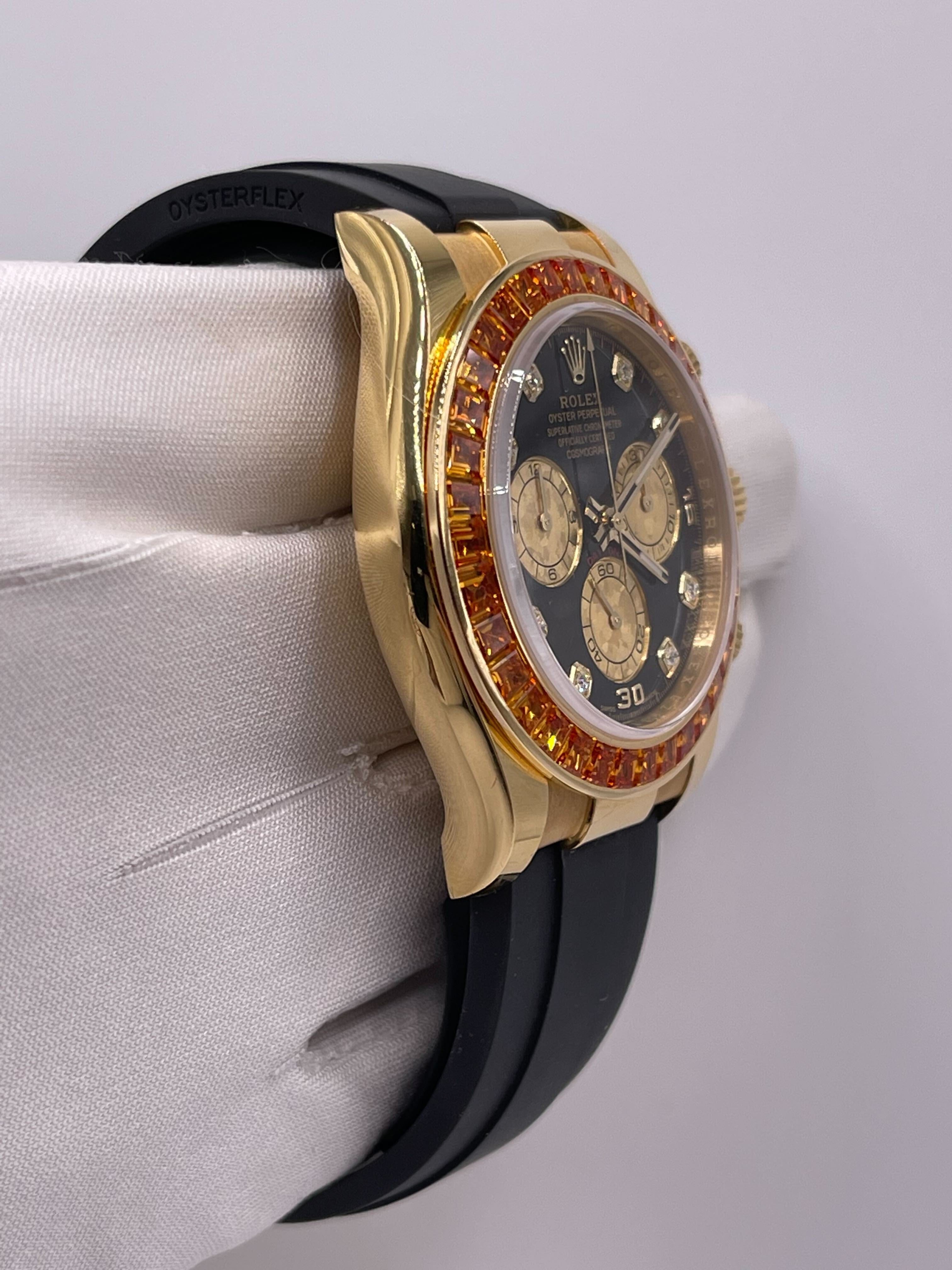 Luxury Watch Rolex Daytona Yellow Gold Orange Sapphire Bezel Black Diamond Dial 116588SACO Wrist Aficionado