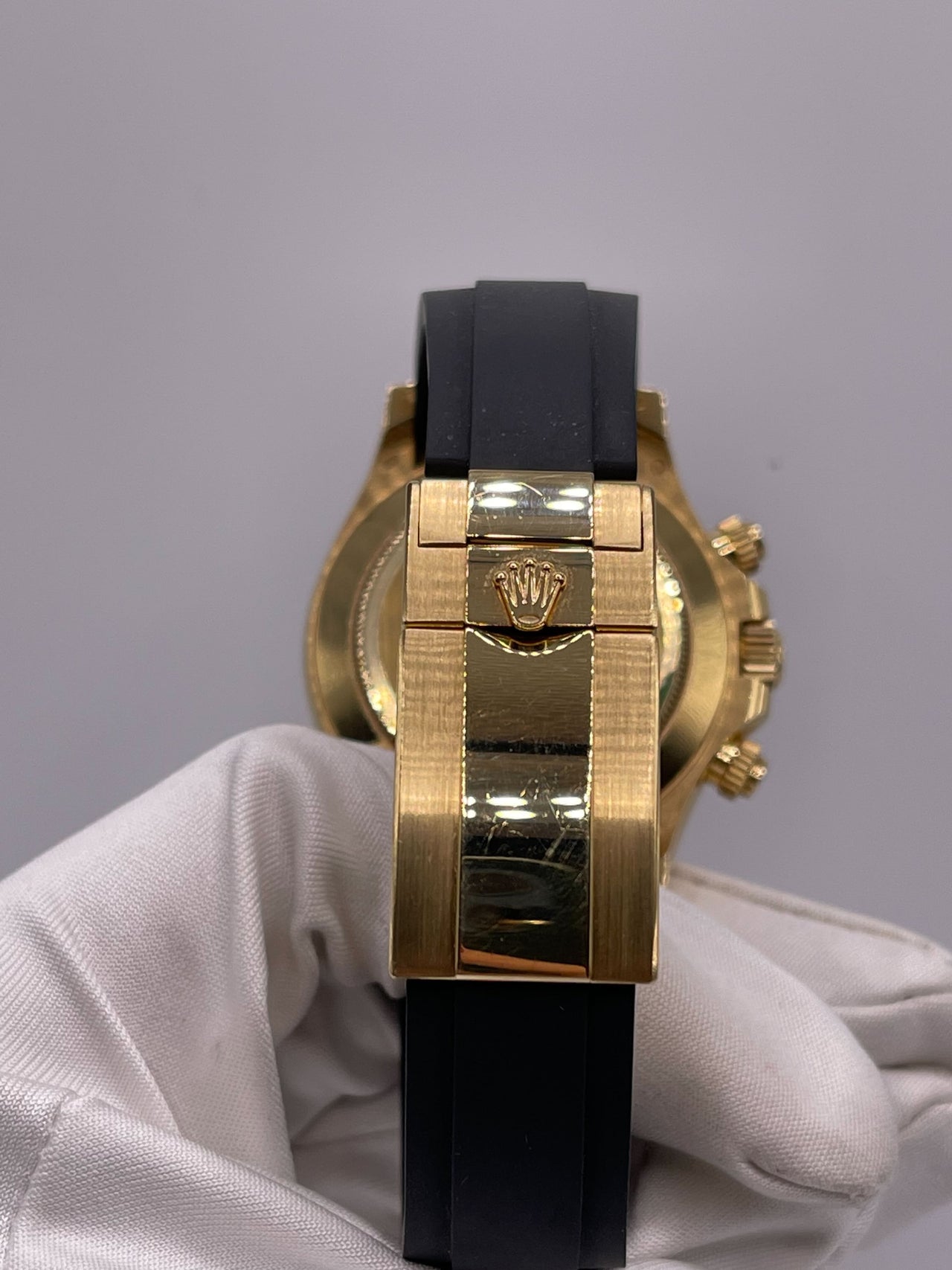 Luxury Watch Rolex Daytona Yellow Gold Orange Sapphire Bezel Black Diamond Dial 116588SACO Wrist Aficionado