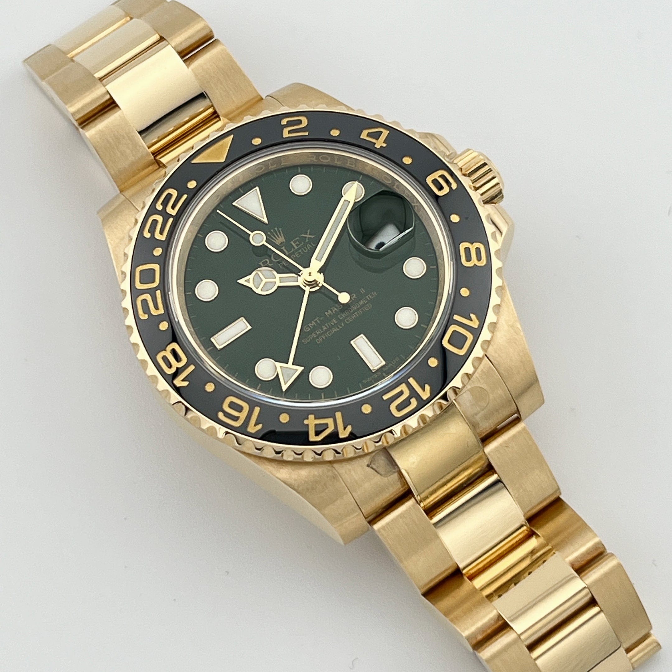 Rolex GMT-Master II 116718LN Yellow Gold Green Dial Black Bezel