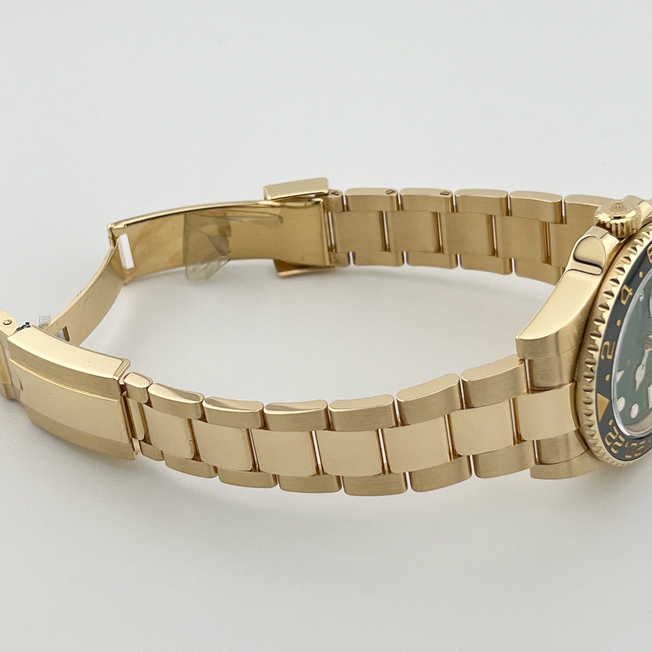 Rolex GMT-Master II 116718LN Yellow Gold Green Dial Black Bezel