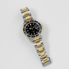 Rolex GMT-Master II 16713 Stainless Steel Yellow Gold Black Dial (1997)