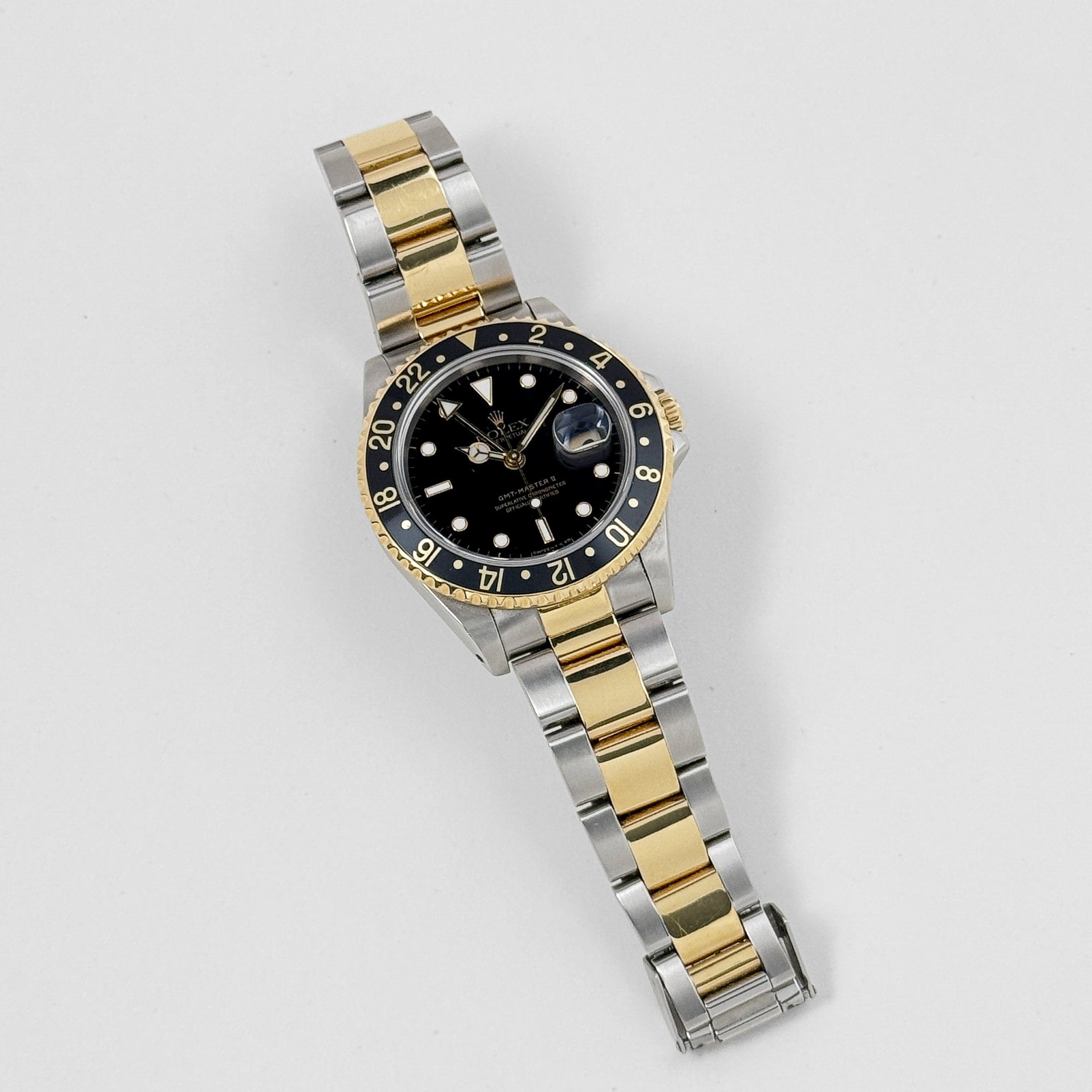 Rolex GMT-Master II 16713 Stainless Steel Yellow Gold Black Dial (1997)
