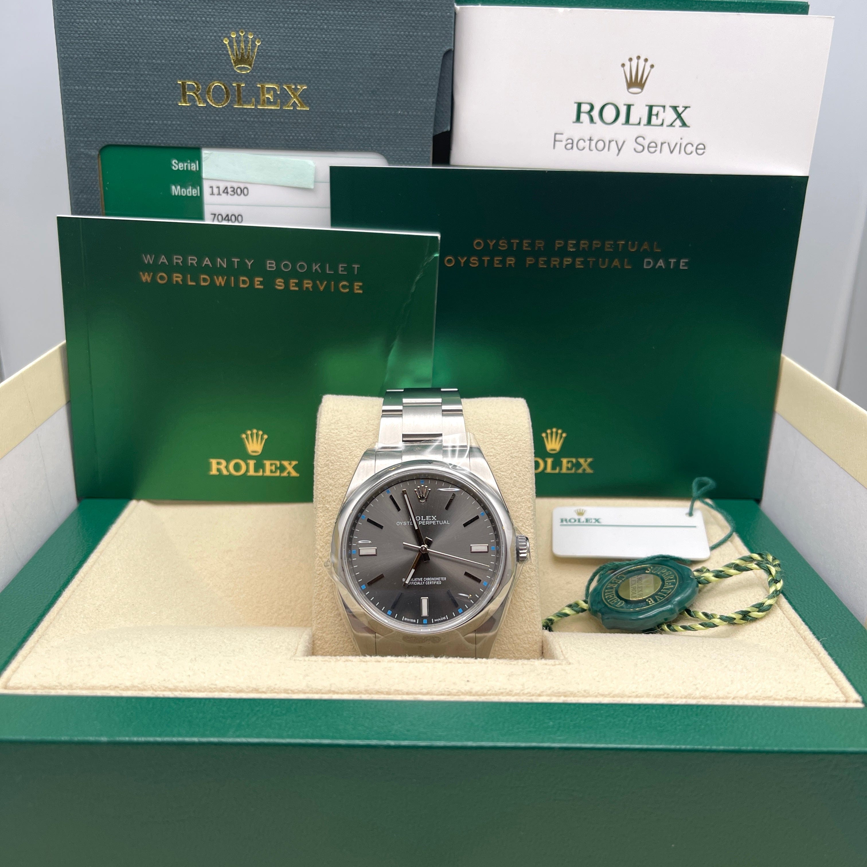 Rolex Oyster Perpetual 39mm Stainless Steel Rhodium Dial 114300 Wrist Aficionado